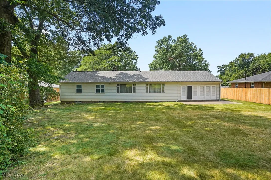 Rear view of house featuring a patio