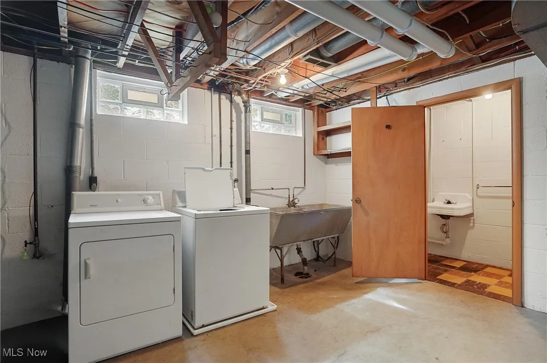 Laundry room featuring separate washer and dryer