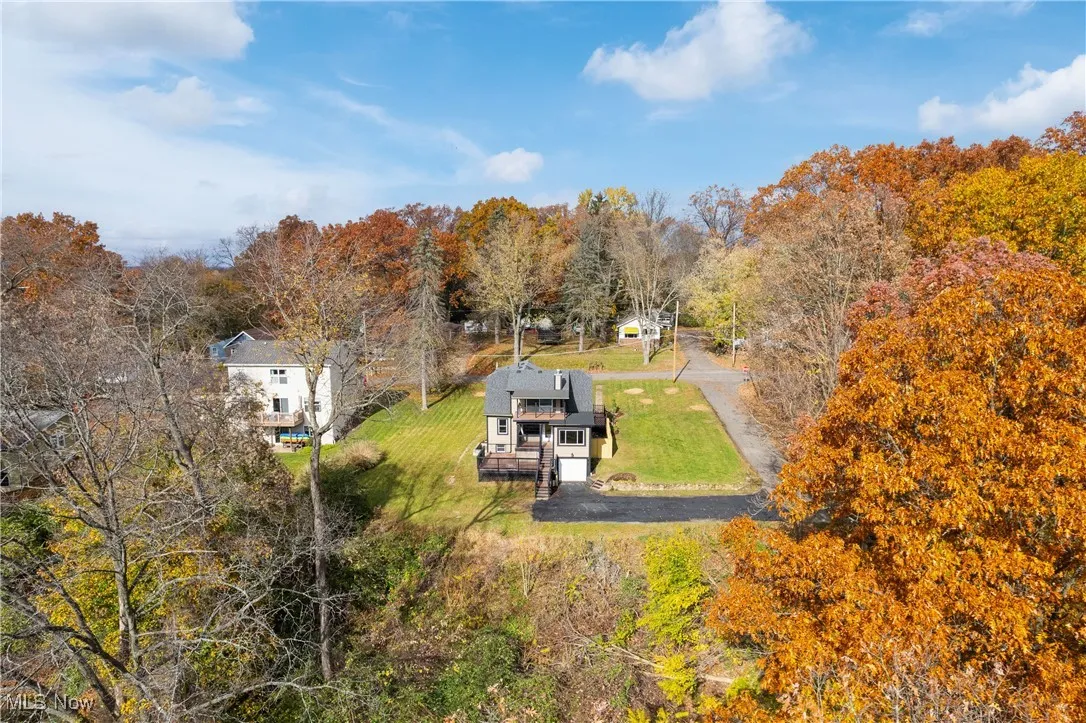 View of subject property featuring a forest