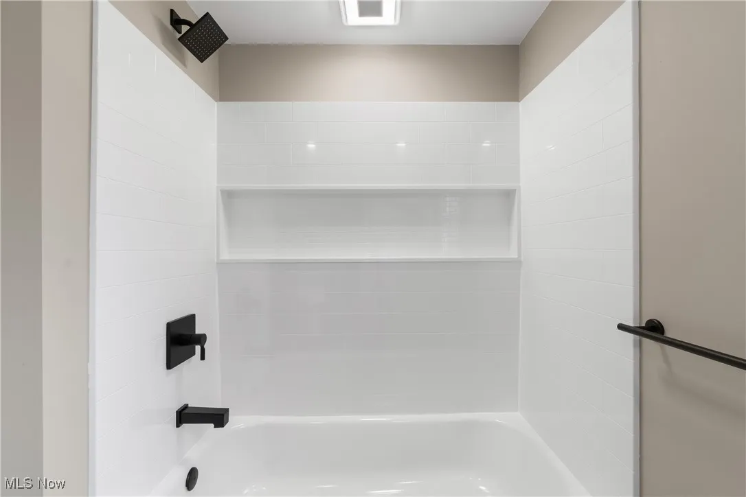 Full bath featuring tub / shower combination