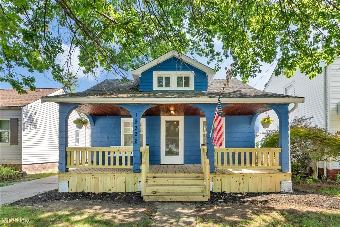 Bungalow-style house with covered porch and roof with shingles