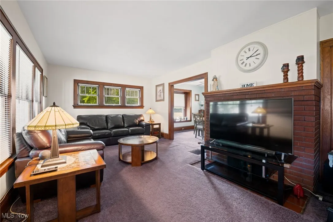 Living room with carpet and baseboards