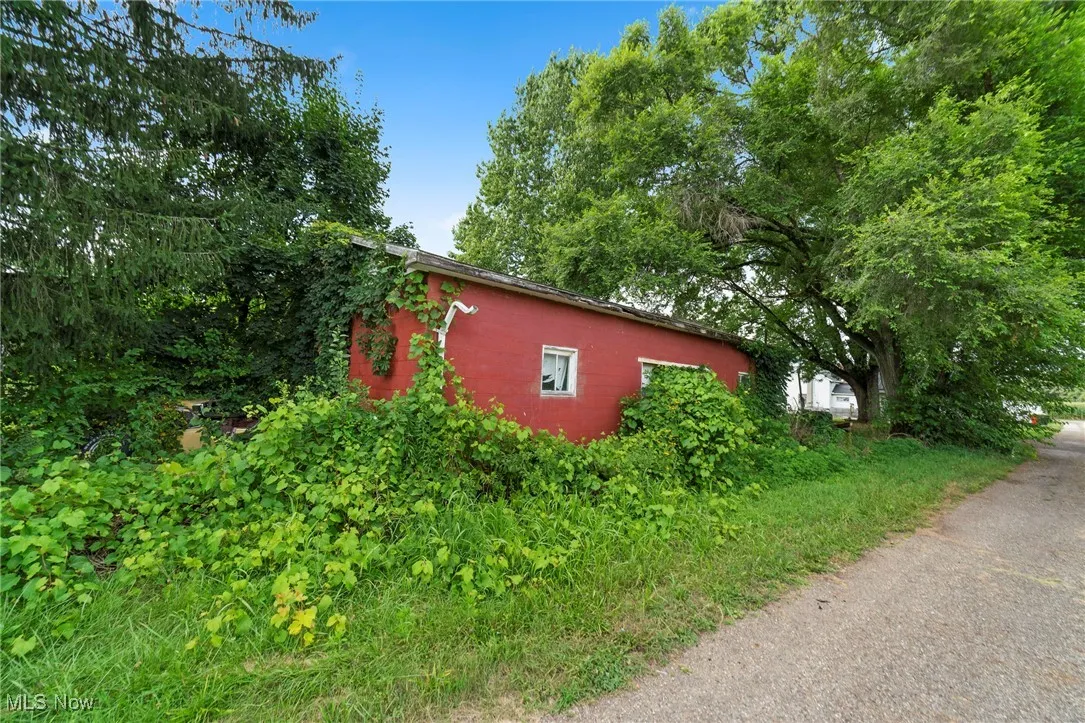 View of side of property with concrete block siding