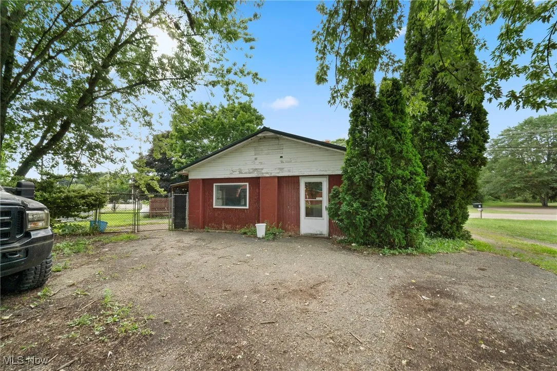 Bungalow-style home with a gate