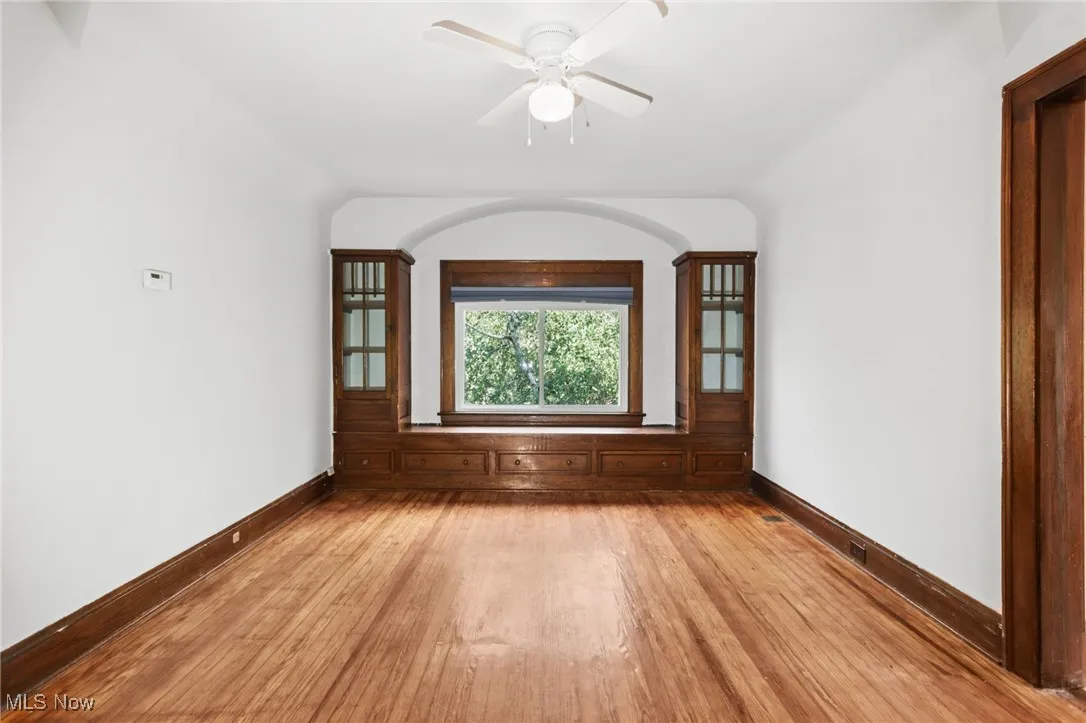 Unfurnished room with light wood-style floors and ceiling fan