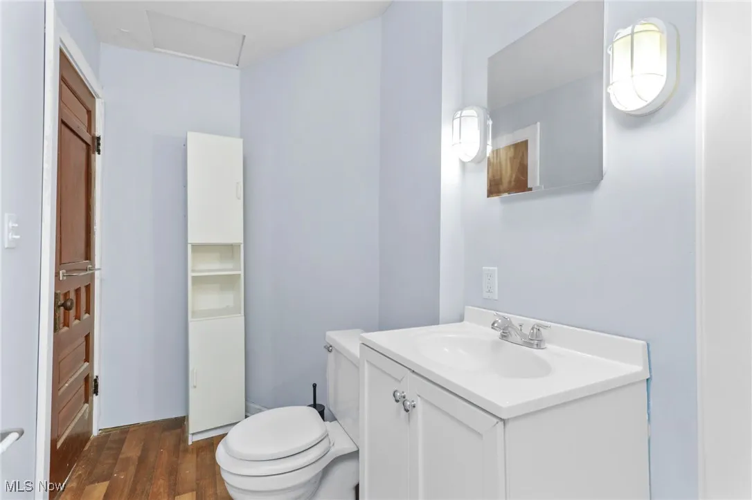 Bathroom featuring vanity and wood finished floors