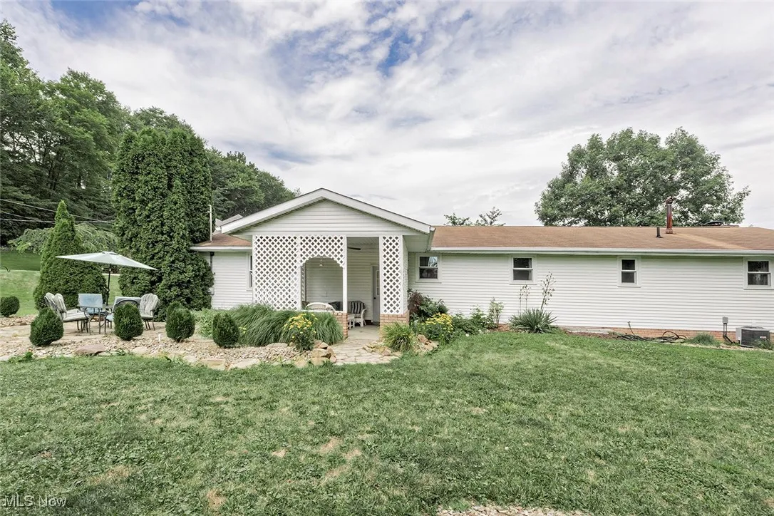 View of front of home featuring a patio area and a front lawn