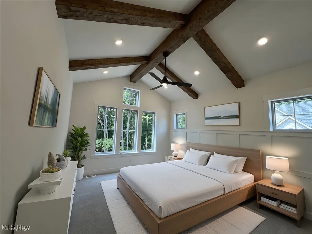 Carpeted bedroom featuring multiple windows and recessed lighting