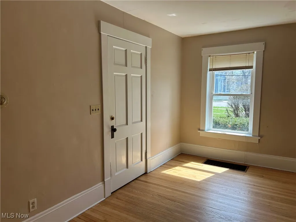 Entryway featuring baseboards and light wood-style floors