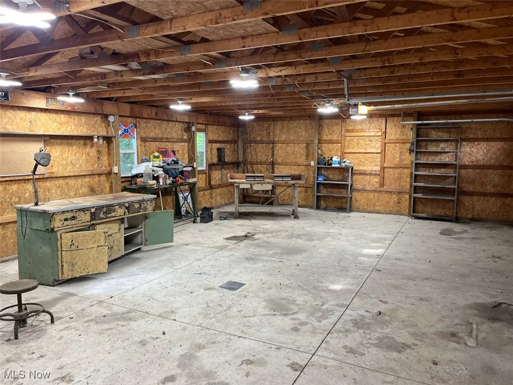 Garage featuring a workshop area