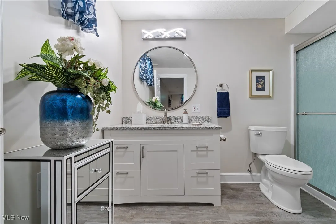 Lower level full bath with ceramic tile, shower