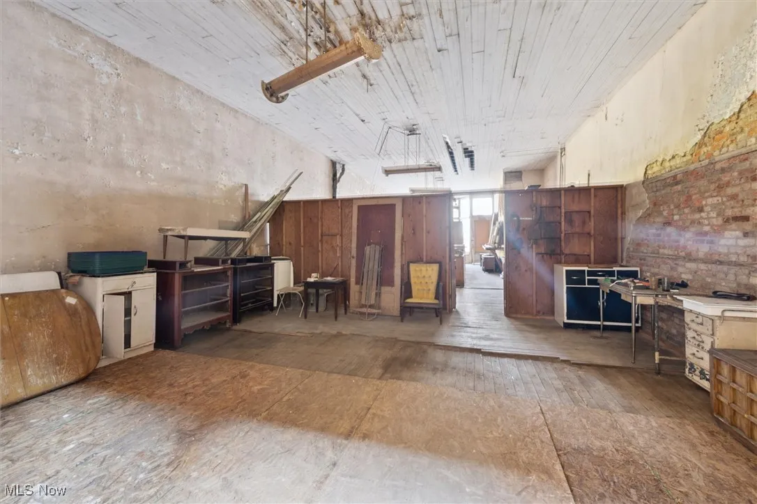 Miscellaneous room featuring hardwood  back area