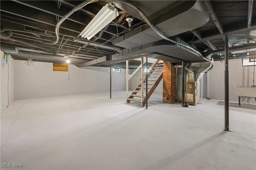 Unfinished basement featuring stairs