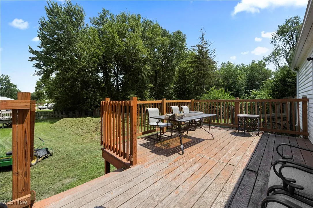 Wooden deck featuring outdoor dining area