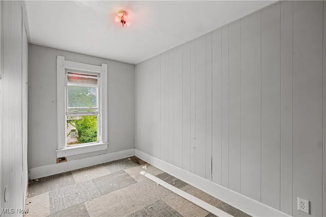 Empty room with wooden walls