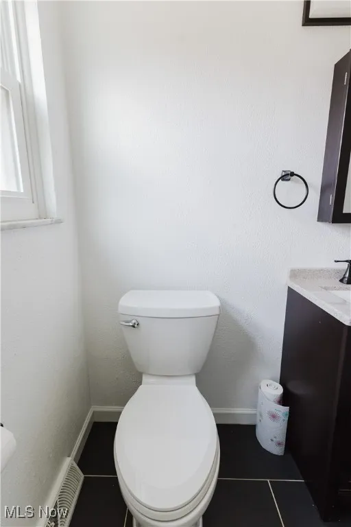 Bathroom with vanity and tile patterned floors