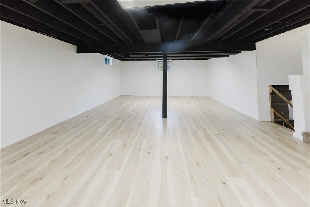 Below grade area featuring wood finished floors