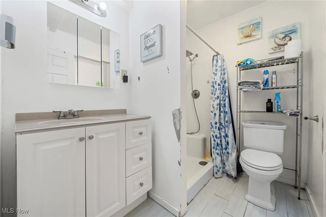 Bathroom with vanity and a shower with curtain