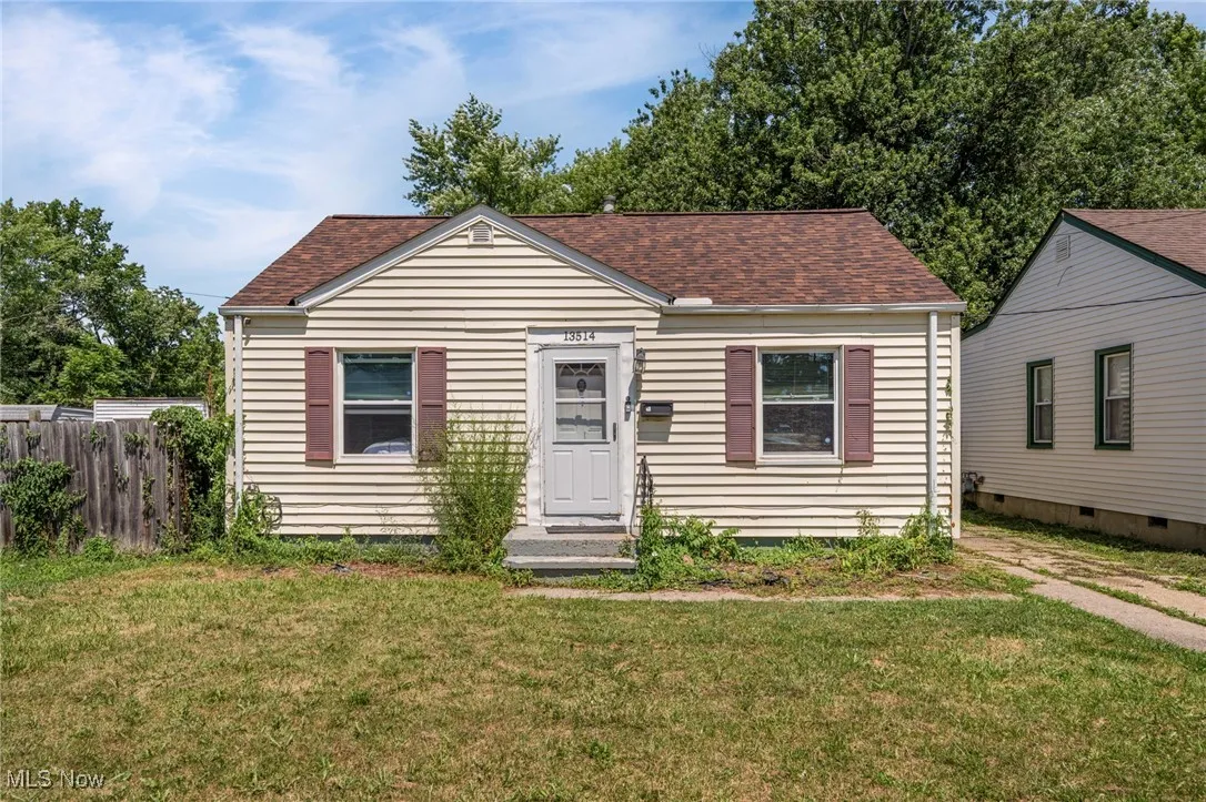Bungalow-style home featuring a shingled roof and crawl space