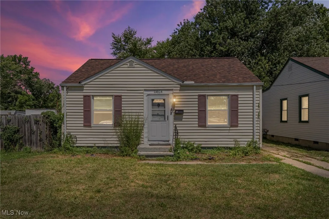 Bungalow-style house featuring a shingled roof and crawl space