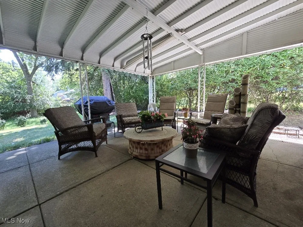 View of patio with an outdoor living space