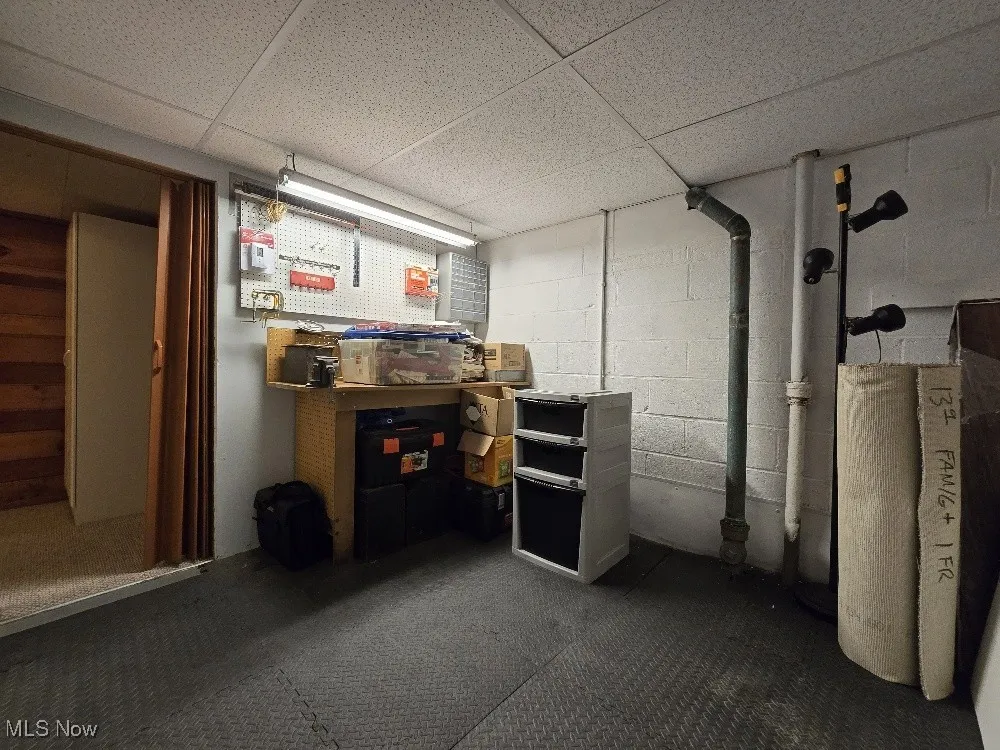 Unfinished below grade area with a drop ceiling