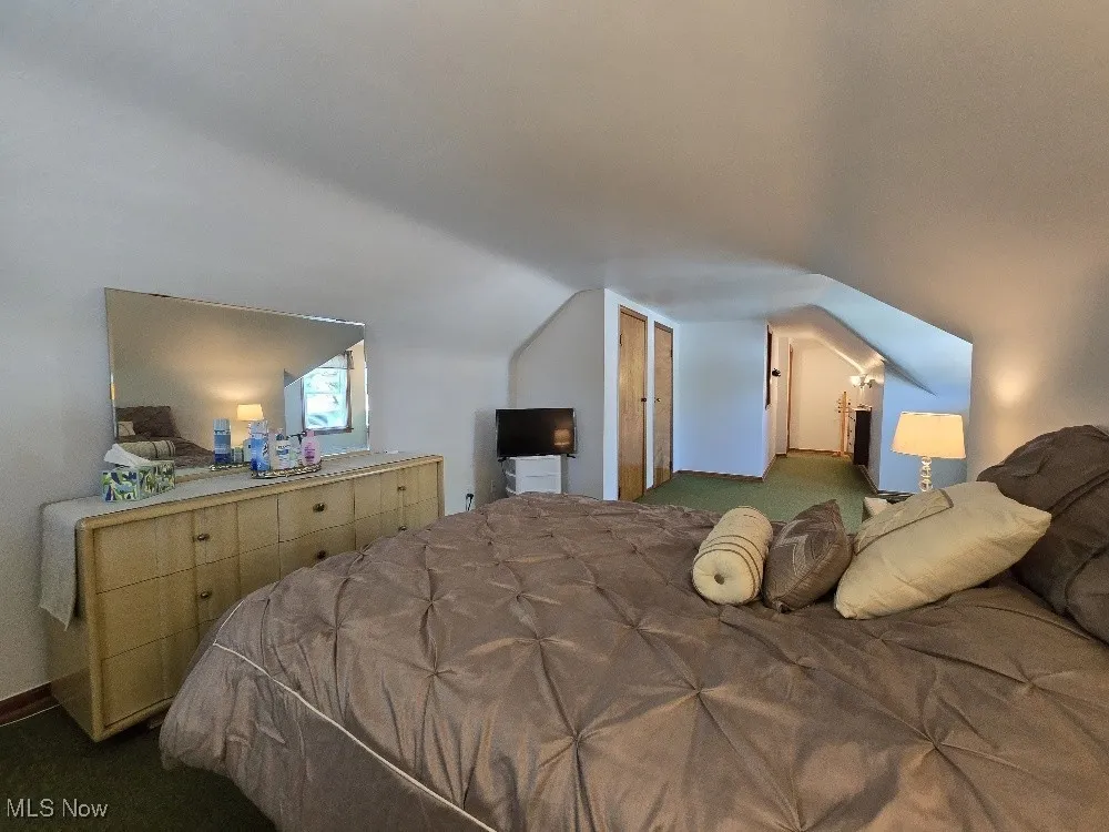 Bedroom with dark carpet