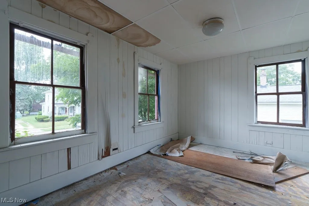 Empty room featuring wooden walls