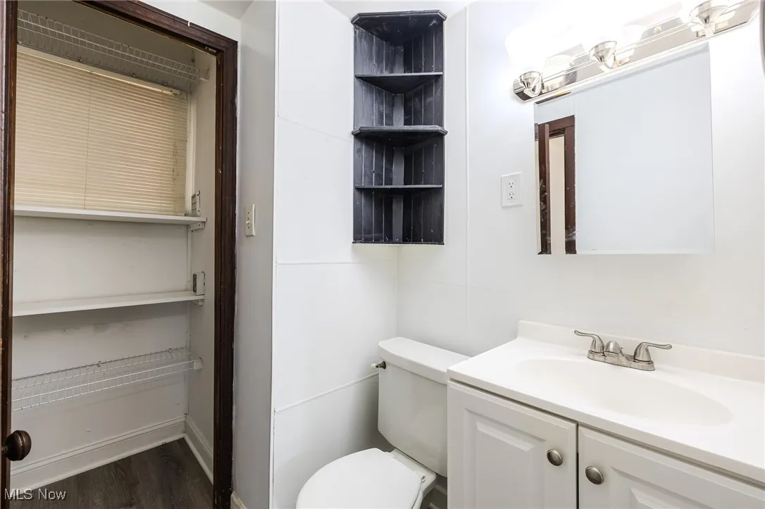 Bathroom featuring vanity and wood finished floors