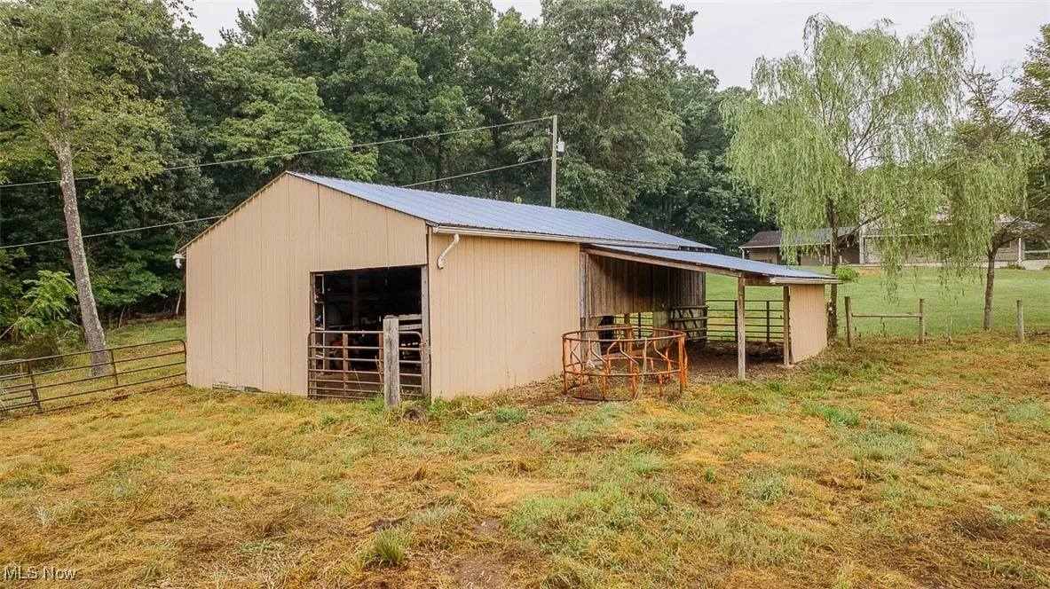 View of outbuilding featuring an exterior structure