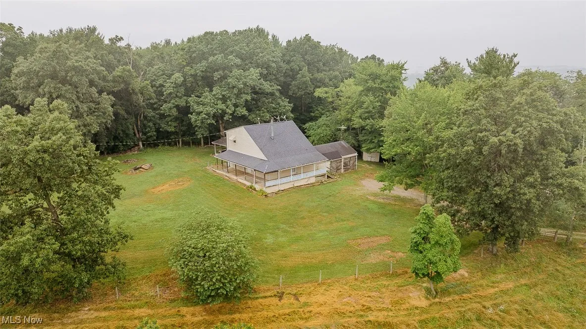 Aerial view of sparsely populated area with a heavily wooded area