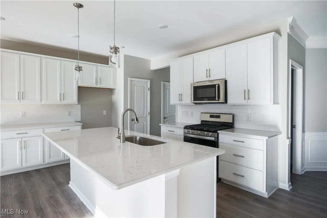 The large kitchen island overlooks your primary living space.
