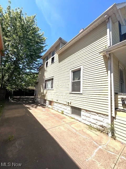 View of side of home with a patio area