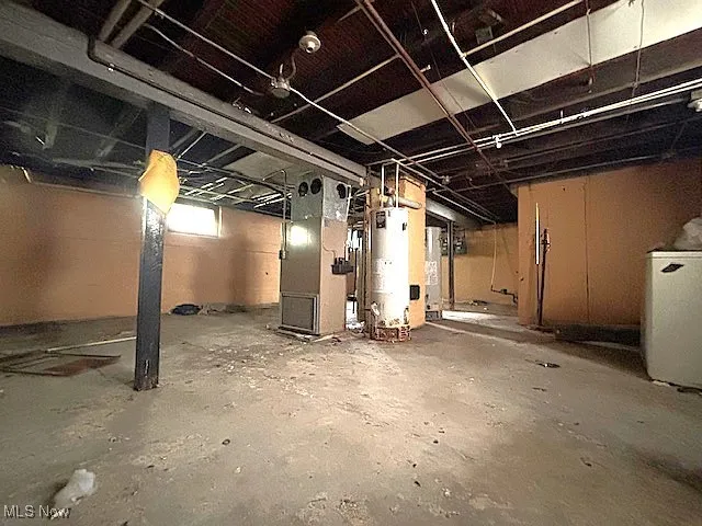 Basement featuring water heater