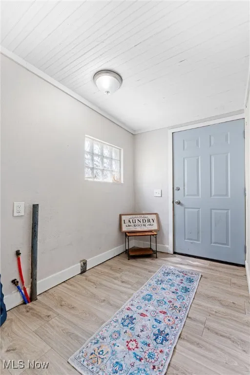 Entrance foyer featuring wood finished floors and wood ceiling