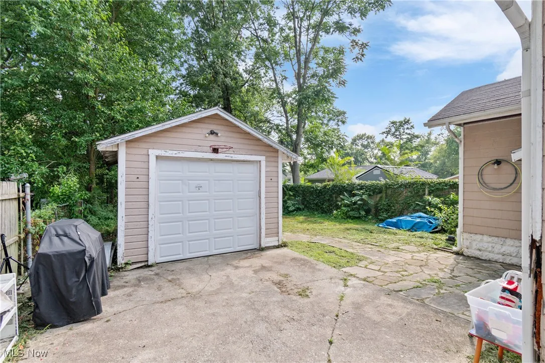 Detached garage featuring driveway