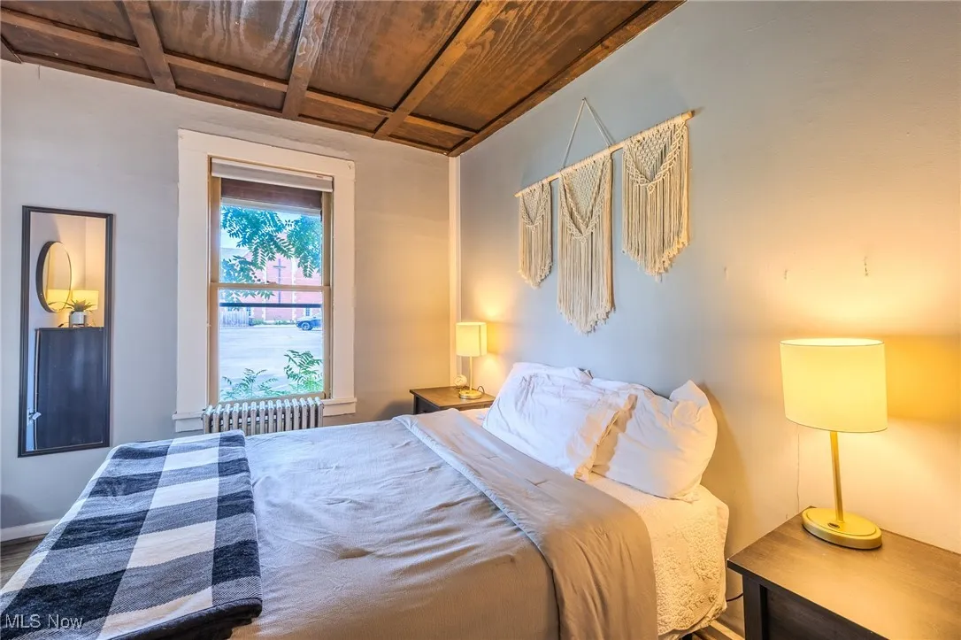 Bedroom with coffered ceiling
