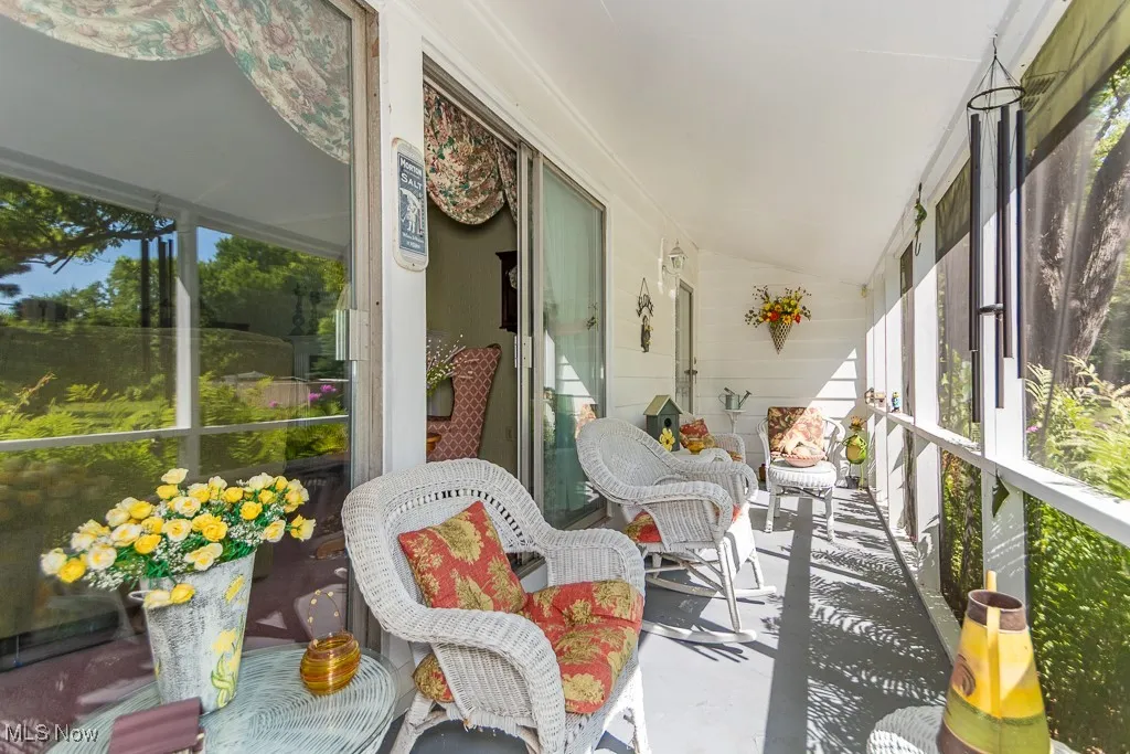 Sunroom featuring lofted ceiling