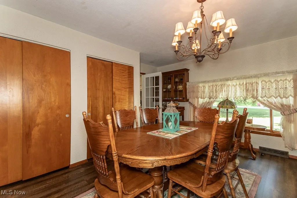 Dining room with a chandelier and wood finished floors