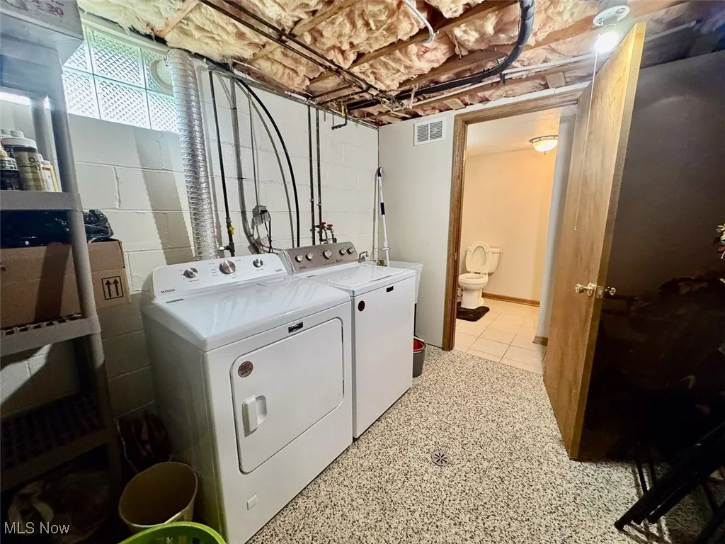 Laundry room with washing machine and dryer