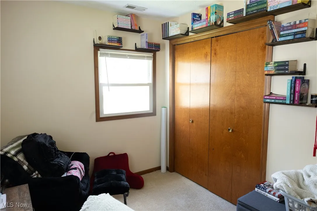 Living area with carpet flooring