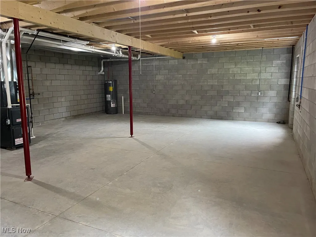 Unfinished basement with electric water heater