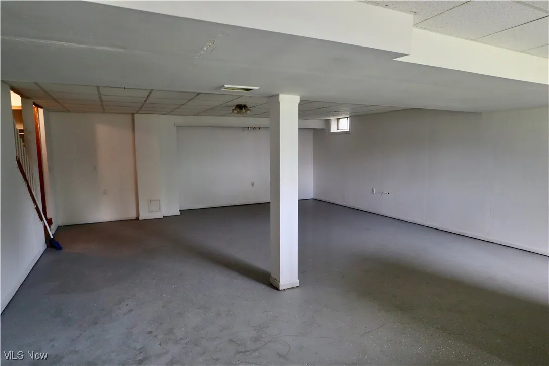 Below grade area with a paneled ceiling