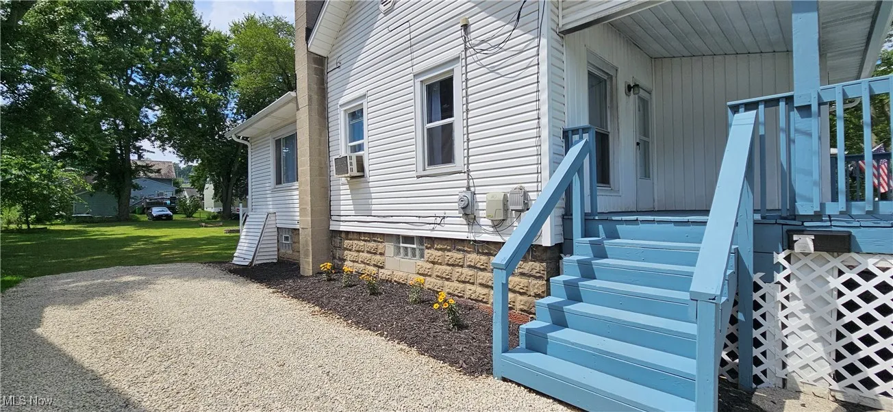 View of exterior entry and driveway
