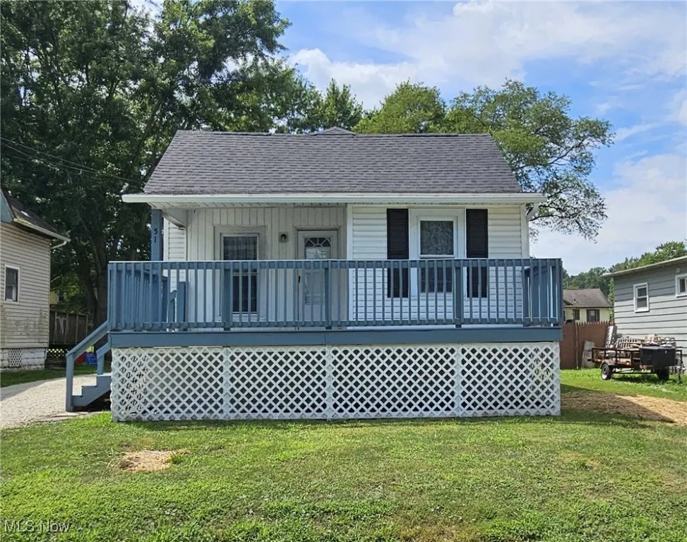 Bungalow-style house with a front lawn, large front porch, and roof with new shingles