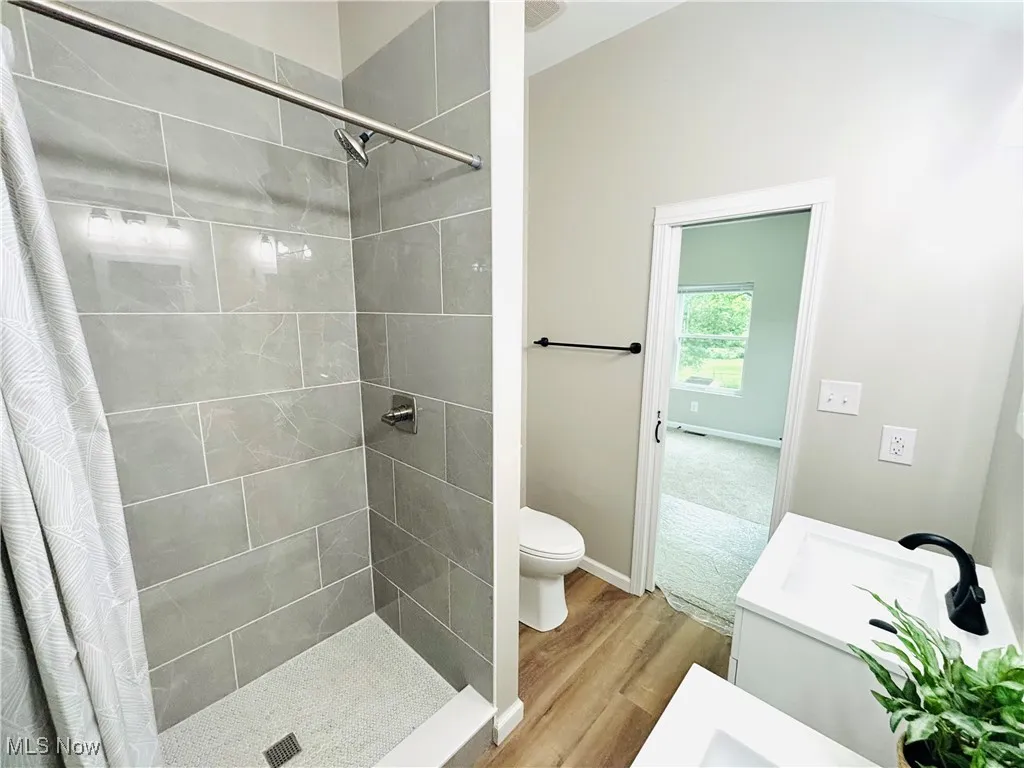 Jack and Jill bath with custom shower.