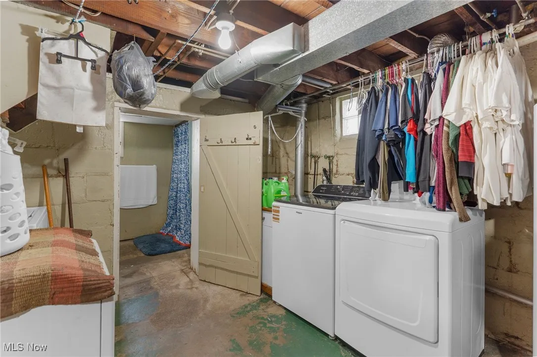 Below grade area featuring washer and dryer
