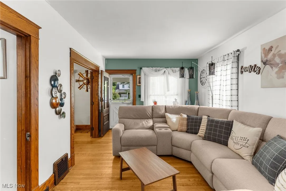 Living area with light wood-type flooring and baseboards
