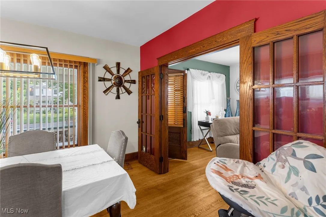 Dining room with wood finished floors and baseboards
