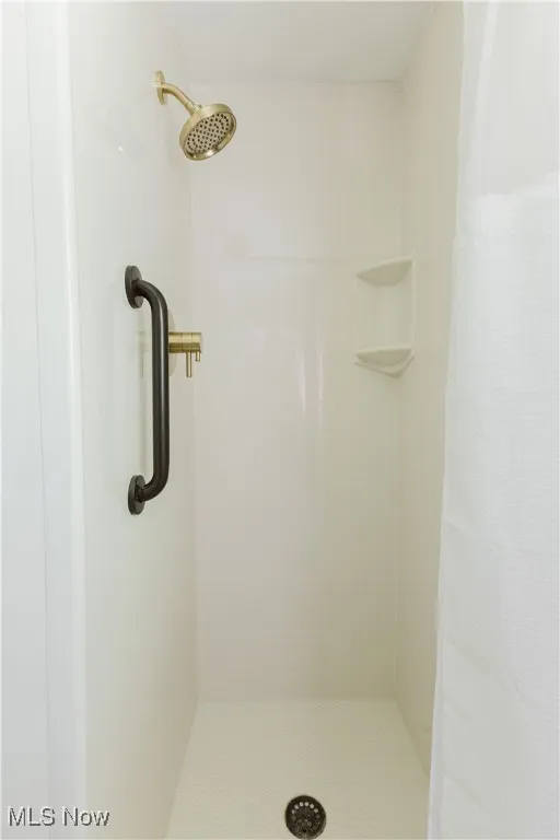 Full bathroom with a stall shower